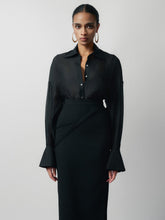 Tailored high-waisted skirt with side-wrap detail and midi silhouette